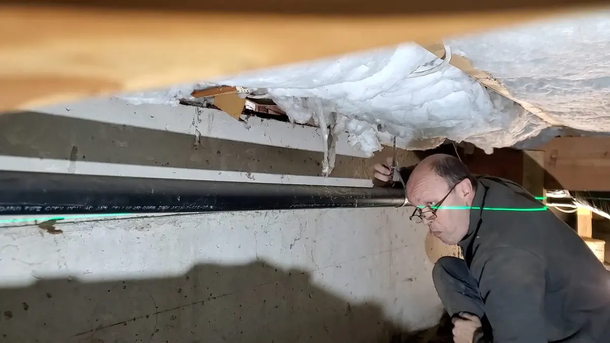 Basement plumbing rough-in with pipes and drain connections illustrating Plumbing Tips for Older Lebanon Homes (Plumbing Tips for Older Lebanon Homes closeup)