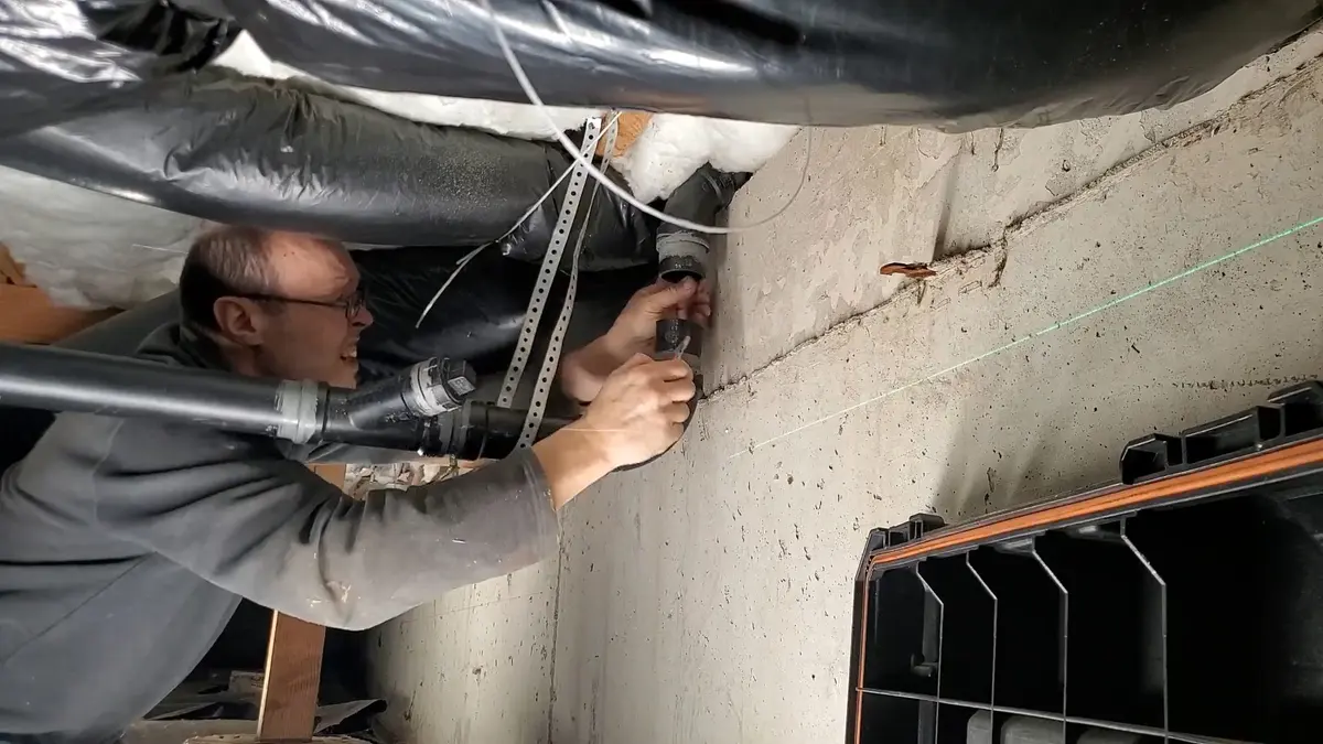 Basement plumbing rough-in with pipes and drain connections illustrating Plumbing Tips for Older Lebanon Homes