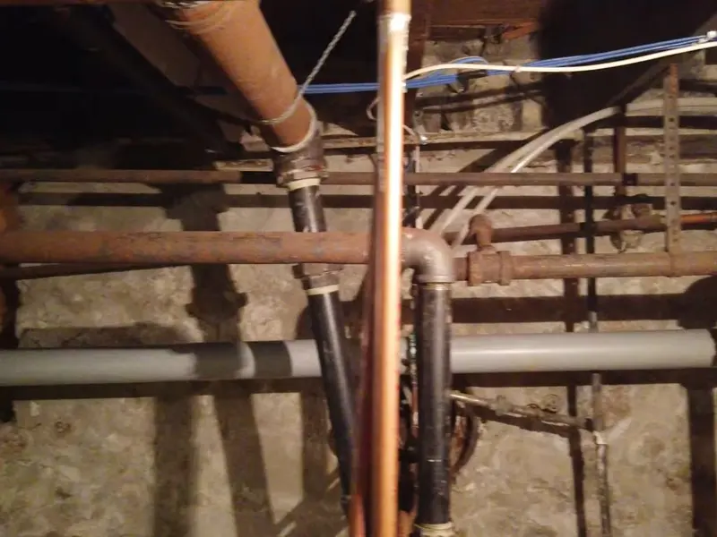 Basement plumbing rough-in with pipes and drain connections for Basement Plumbing in Lebanon, PA | Baths & Pumps (Basement Plumbing in Lebanon, PA | Baths & Pumps detail)