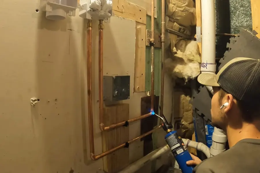 Basement plumbing rough-in with pipes and drain connections illustrating Protecting Your Pipes Through a Lebanon Valley Winter (Protecting Your Pipes Through a Lebanon Valley Winter detail)