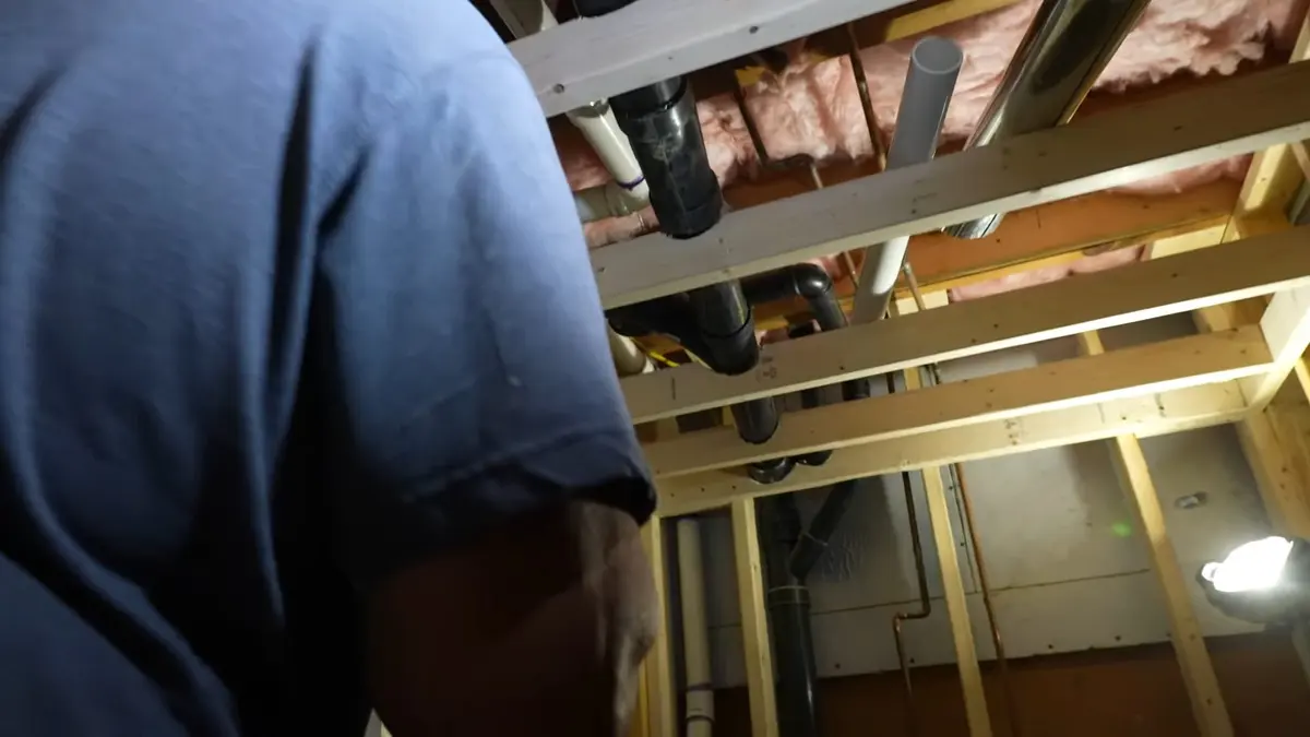 Basement plumbing rough-in with pipes and drain connections illustrating Slow Drains: Snaking vs. Hydro Jetting in Lebanon