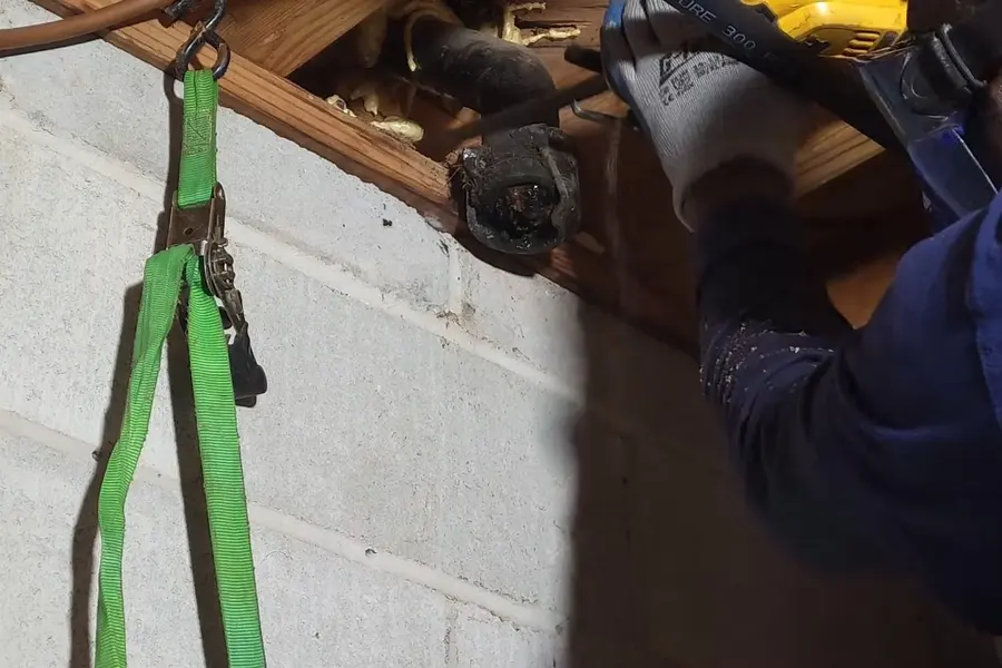 Corroded cast iron drain pipe and replacement connection for Cast Iron Drain Replacement in Lebanon, PA (Cast Iron Drain Replacement in Lebanon, PA closeup)