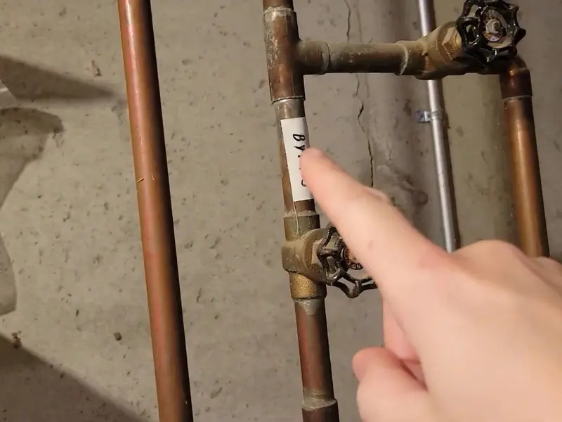 Gas water heater tank with nearby piping for a plumbing service page in Fredericksburg, PA (Fredericksburg, PA Plumber | Northern Lebanon County detail)