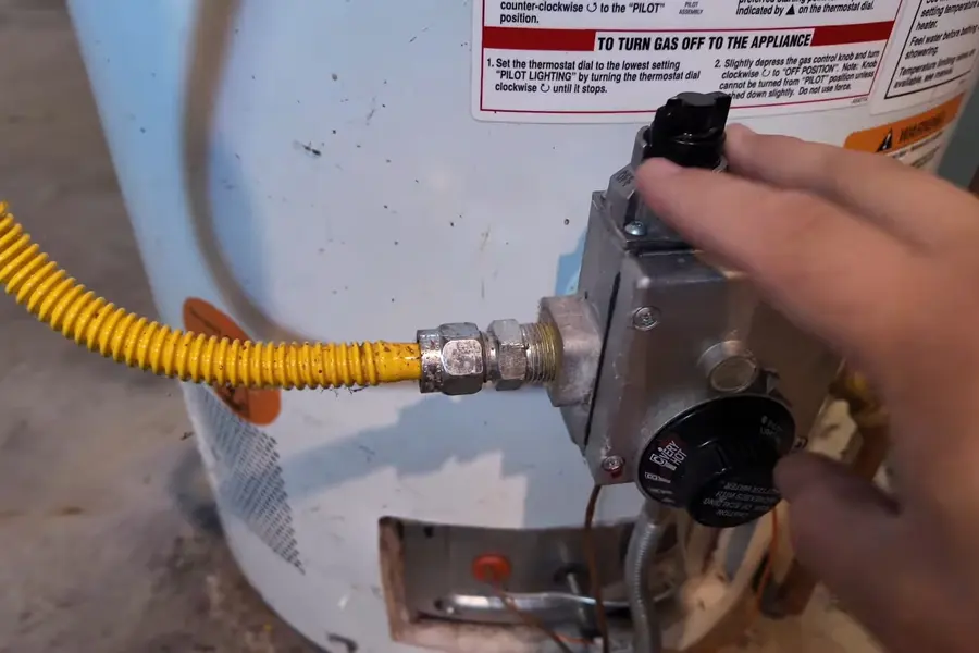 Gas water heater tank with nearby piping illustrating Tank vs. Tankless Water Heaters for Lebanon Homes