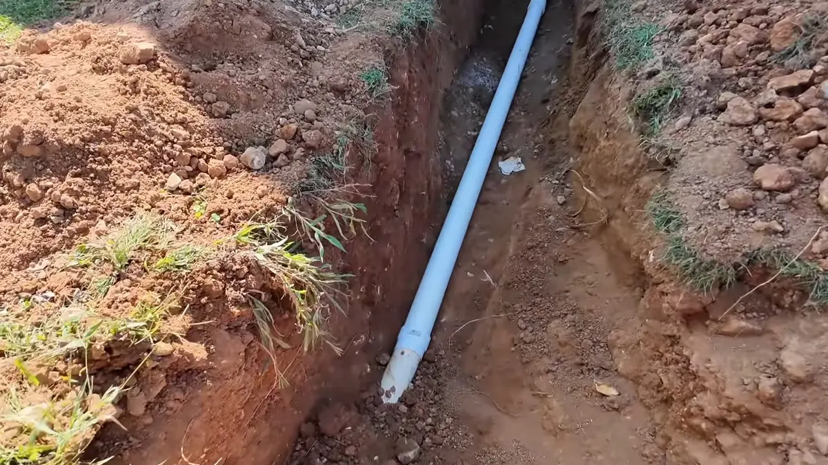 Open trench with new sewer or water line pipe illustrating Plumbing Tips for Older Lebanon Homes