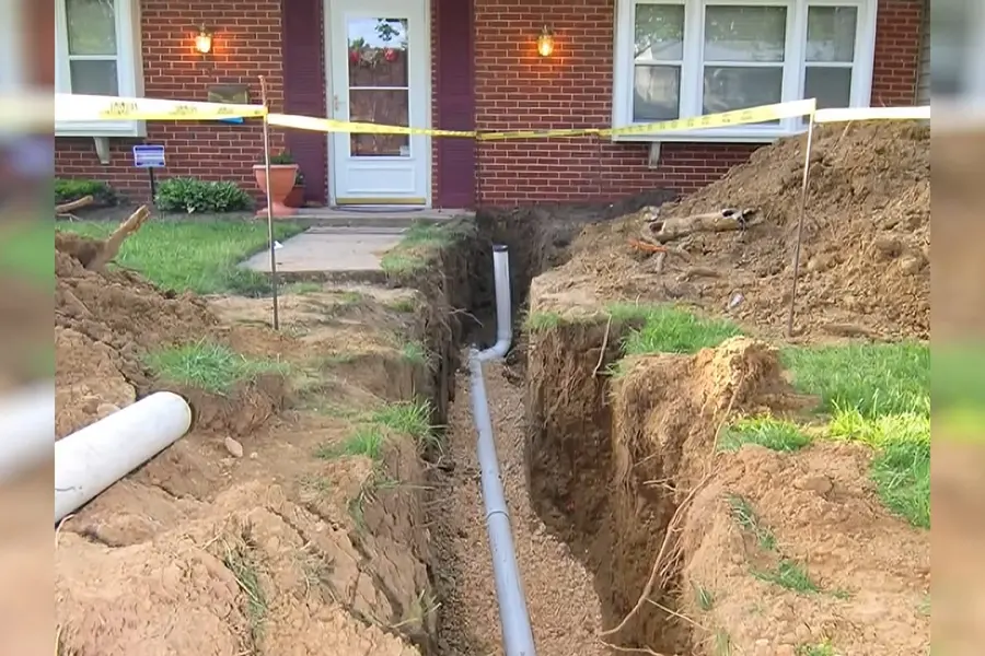 Open trench with new sewer or water line pipe illustrating Does Your Lebanon Home Have a Lead Service Line?
