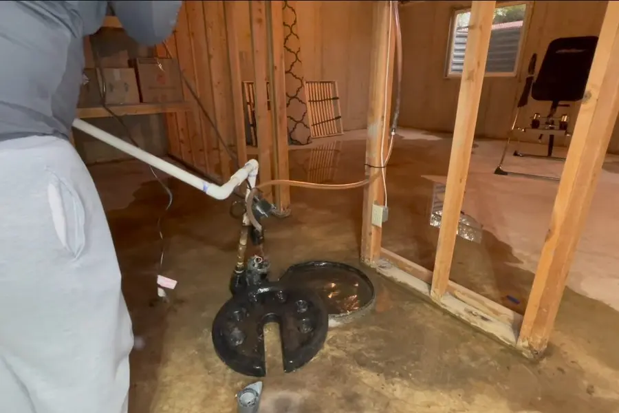 Sump pump and basin in a basement floor illustrating Sump Pumps in Lebanon: Keeping Basements Dry (Sump Pumps in Lebanon: Keeping Basements Dry closeup)