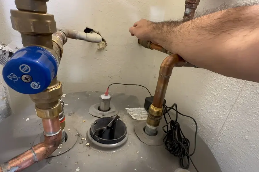 Water heater tank, valve, or repair component illustrating When a Pipe Bursts: The First 10 Minutes