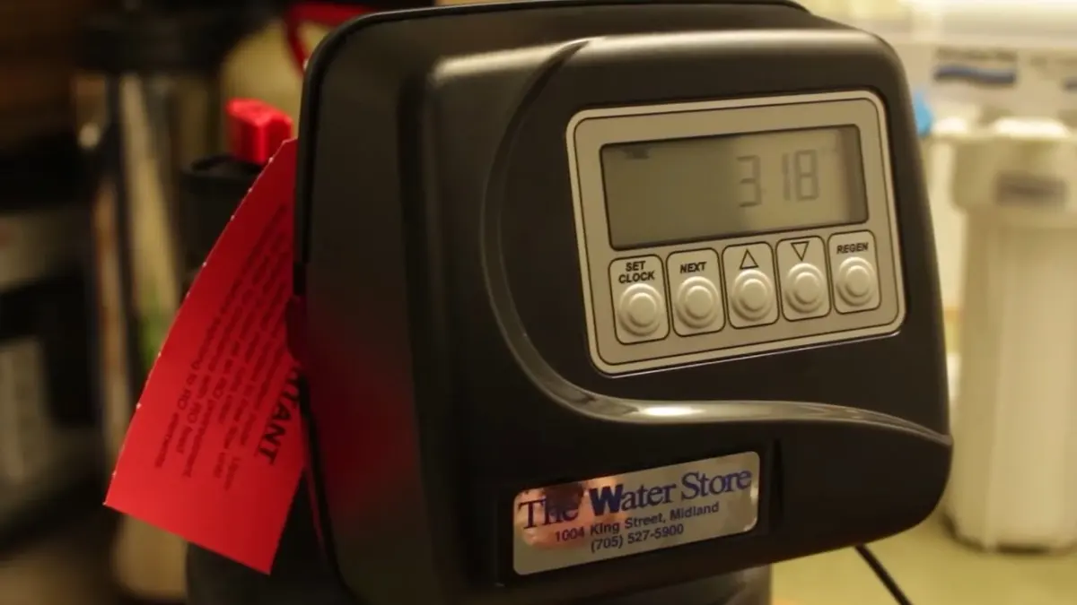Water softener equipment with control head and brine tank illustrating Plumbing Tips for Older Lebanon Homes (Plumbing Tips for Older Lebanon Homes detail)